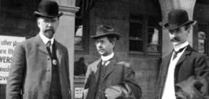 ALA officials stand in front of the Hall of Congresses at the St. Louis World’s Fair, 1904: (left to right) ALA President-Elect Ernest Cushing Richardson, former ALA President Reuben Gold Thwaites, and ALA President Herbert Putnam. Richardson wears one of the white buttons that identifies him as an ALA conference attendee. Photo: ALA Archives