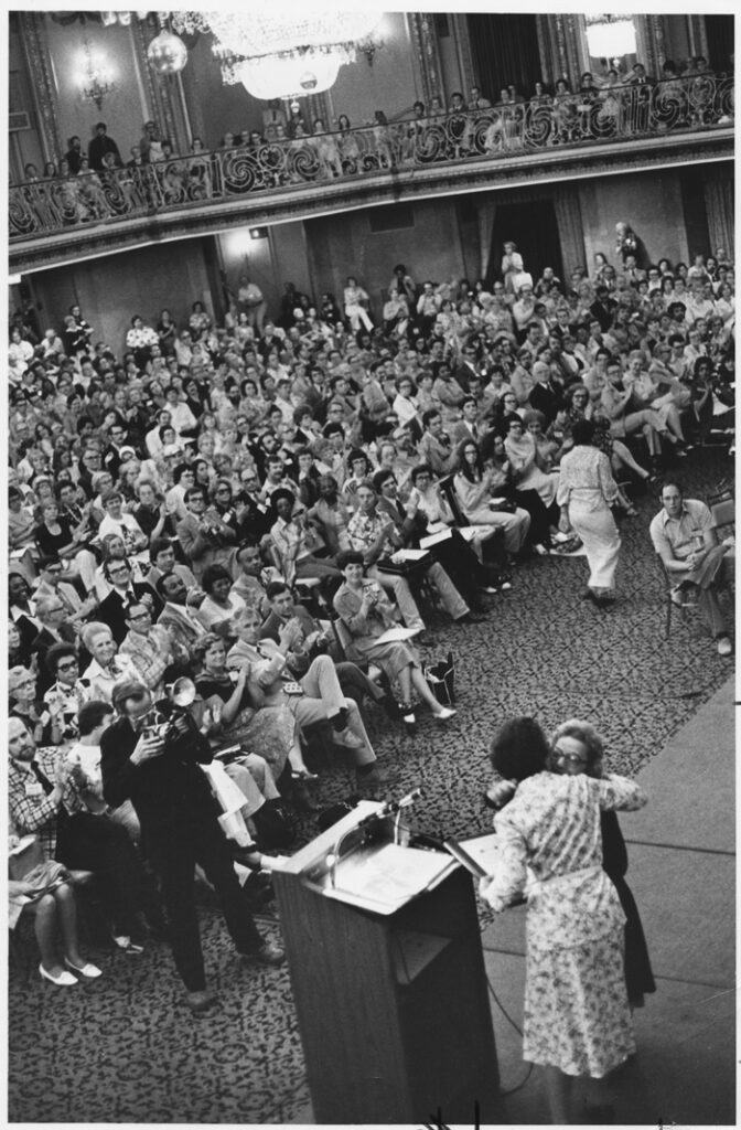 Clara Jones embracing Virginia L. Jones, after V. Jones received an Honorary Membership of ALA during the 1976 ALA Conference.