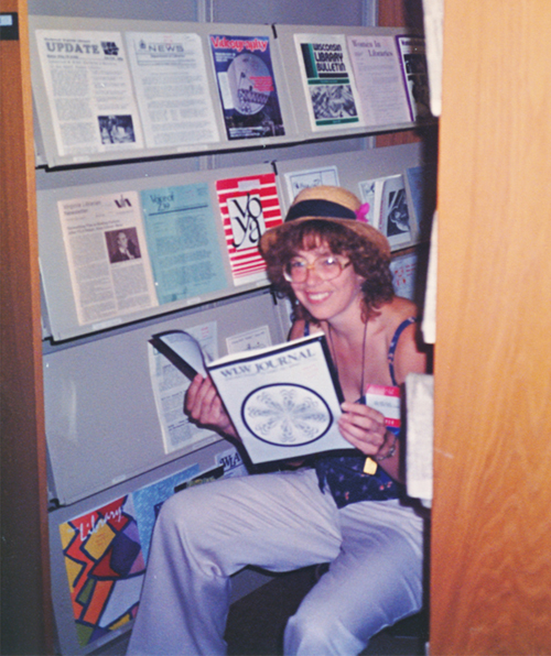 Librarian Carol Starr reads the WLW Journal during the 1985 Annual Conference in Chicago