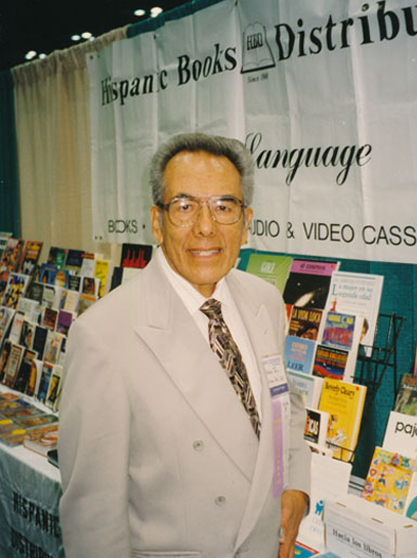 Arnulfo Trejo at the exhibit hall of the REFORMA conference. October 1996. From the ALA Archives.
