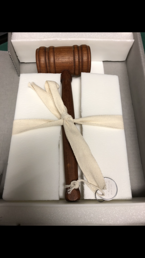 A wooden gavel made from the remains of the McCormick Mansion. A simple staff award or an artifact of a haunted mansion? From the ALA Archives.