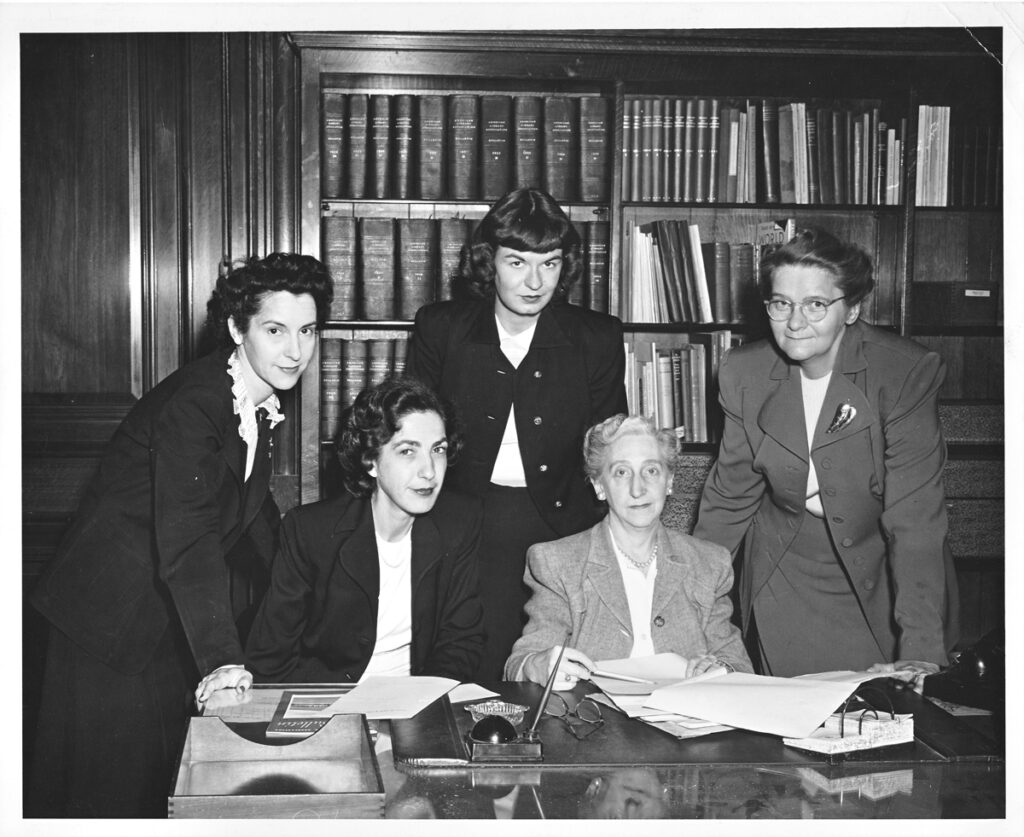 The ALA Membership Services staff at their office in the McCormick Mansion. Are they at ease or do they suspect that otherworldly spirits are nearby, disorganizing the bookcase behind them? From the ALA Archives.
